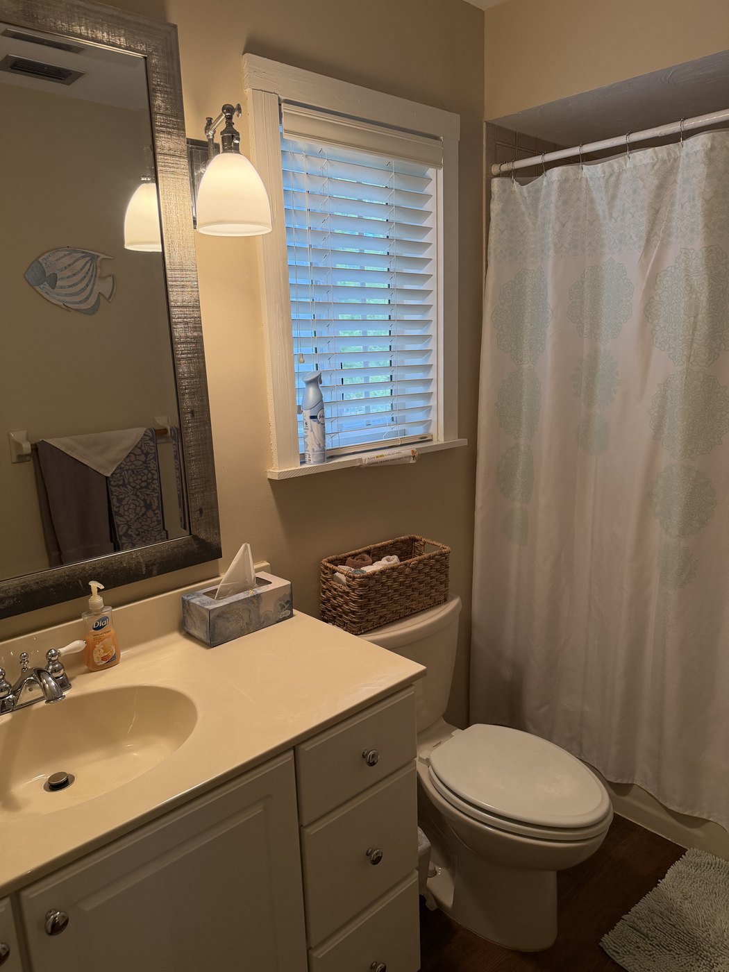 The upstairs bathroom with a tub and shower, serving the two third-floor bedrooms